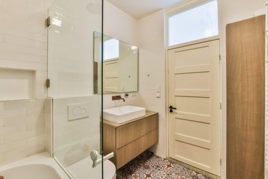 a bathroom with a sink, mirror and toilet paper on the floor in front of the door to the shower room