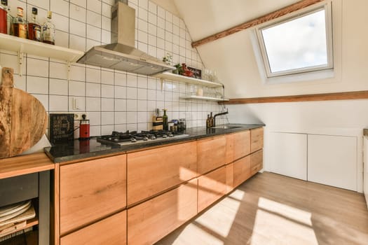 a kitchen with wood cabinets and black counter tops in the center of the image is an open skylight window