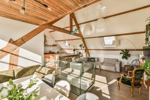 a living room with wood beams and white walls, including a glass coffee table in the center of the room