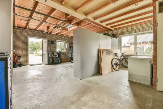 the inside of a building with exposed ceilings and wood beams on the ceiling, while it's not in use