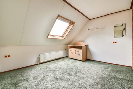 a room with an attic style roof and skylights on the top of the roof is very bright green carpet