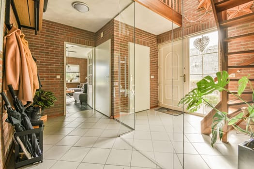 a bathroom with red brick walls and white tile flooring that has been used as an entrance way to the room