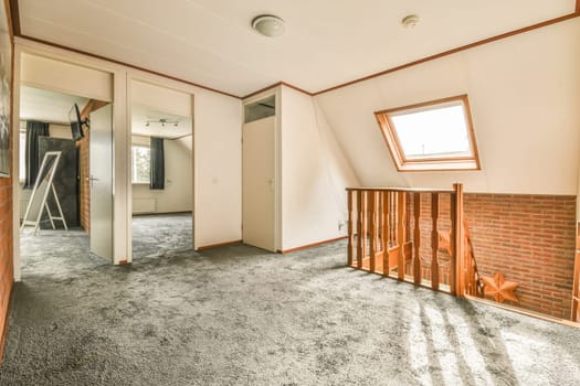 the inside of a house with no windows or doors, and an open door leading to another room that is not in use