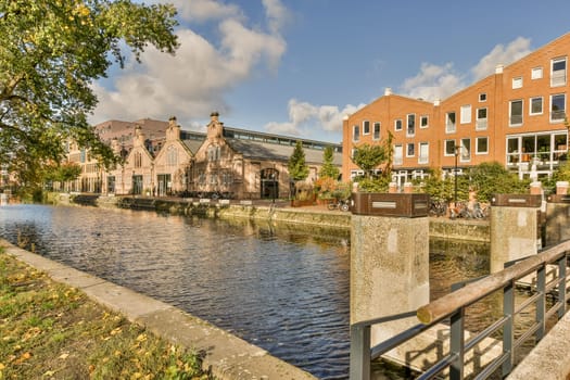 a canal with buildings in the background and water on both sides, as well for boats to pass through it