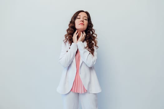 brunette woman hugging herself on white office background