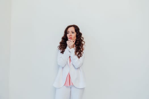 brunette woman pondering on white office background