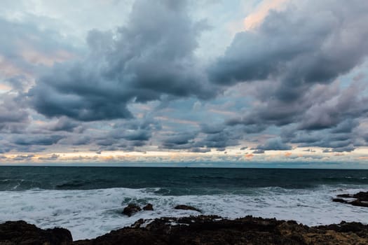Beautiful landscape sea with waves and clouds at sunset