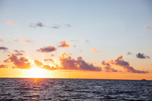 Beautiful landscape sea with waves and clouds at sunset