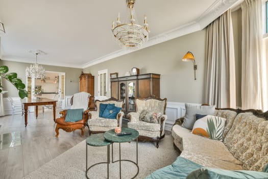 A stylish modern living room featuring elegant furniture, decorative lighting, and a harmonious color palette that creates a warm and inviting atmosphere.