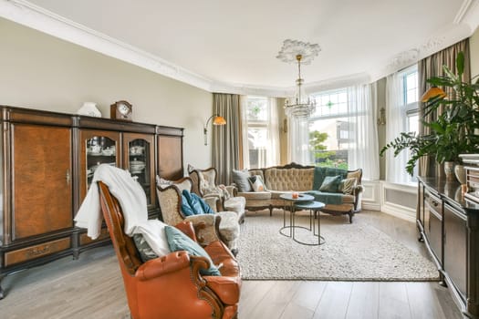 A beautifully arranged living room featuring classic furnishings, plush seating, and natural light illuminating the space, creating a warm and inviting atmosphere.