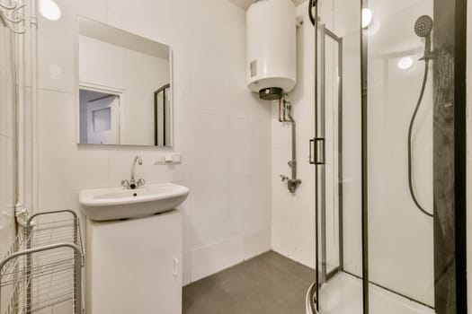A sleek and modern bathroom featuring clean lines, a compact sink, an elegant shower, and a minimalistic design. Perfect for contemporary living spaces.