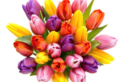 A vibrant bouquet filled with a diverse array of tulips in shades of pink, yellow, orange, and purple is arranged beautifully. This spring floral display captures the essence of the season.