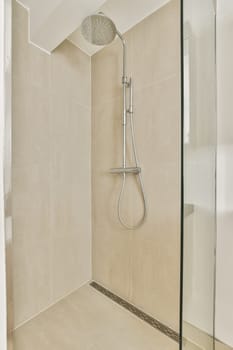 A sleek and contemporary shower featuring clean lines and a spacious layout. The neutral tones enhance the calming atmosphere of the bathroom.