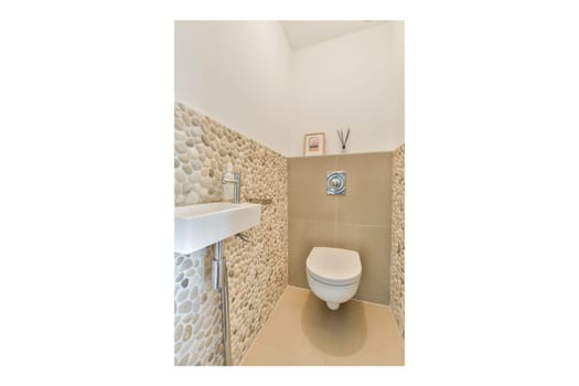 A contemporary bathroom design featuring stylish stone walls, a sleek toilet, and minimalist decor highlighting modern aesthetics.