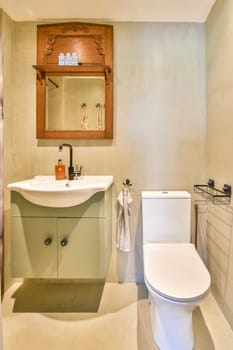A stylish modern bathroom featuring a sleek toilet, a contemporary sink with cabinetry, and charming wooden accents, emphasizing a clean and functional design.