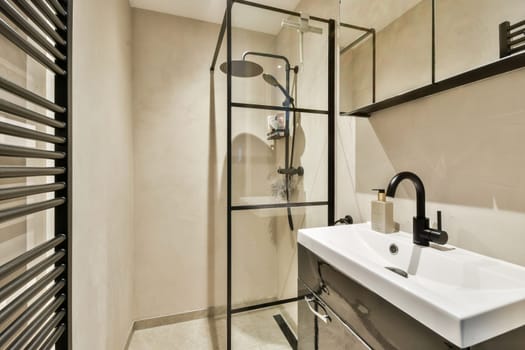 Sleek and contemporary bathroom featuring a glass shower enclosure, modern sink, and stylish fixtures, combining functionality with elegance.
