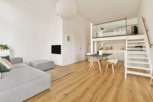 A cozy and modern minimalist apartment featuring open space, elegant furniture, and natural light enhancing the interior design aesthetic.