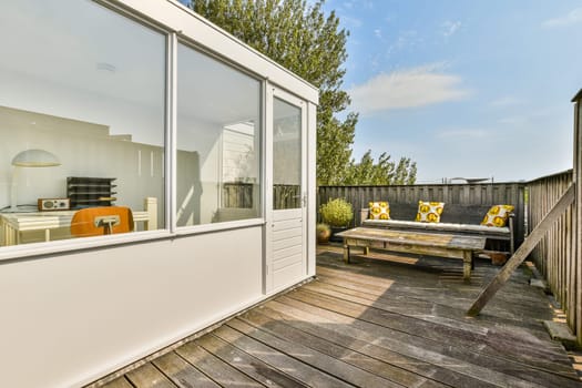 A stylish outdoor patio featuring contemporary furniture, vibrant cushions, and a serene atmosphere, perfect for relaxation and gatherings.