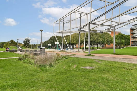 A vibrant modern park showcasing unique architectural elements, lush green areas, and recreational facilities for community enjoyment.
