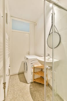 A well-designed laundry room showcasing a washing machine, wooden storage, and sleek mirrors in a clean white environment, enhancing functionality and aesthetics.
