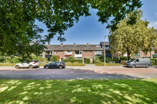 A picturesque view of a tranquil residential street lined with well-maintained houses and abundant greenery, providing a serene atmosphere.