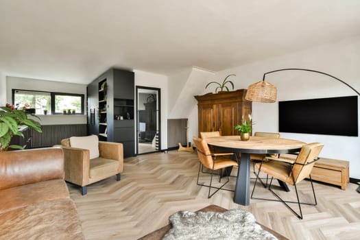 A contemporary living room featuring elegant furniture, warm tones, and minimalist design that creates a cozy atmosphere for relaxation and gatherings.