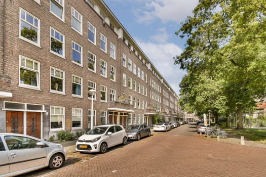 A picturesque street featuring modern urban buildings alongside vibrant trees, showcasing a blend of architecture and nature in a serene environment.