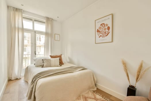A serene and inviting modern bedroom featuring soft colors, comfortable bedding, and natural light illuminating the tranquil space.