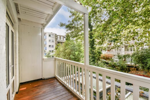 A serene balcony view featuring lush greenery and a well-maintained garden, perfect for relaxation and enjoying nature's beauty.