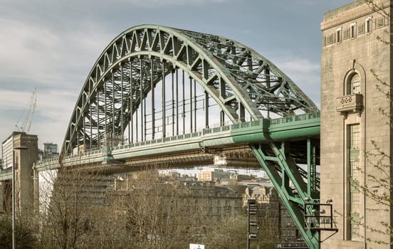Newcastle, UK - Apr 11, 2025 - A view of Tyne Bridge featured at a dynamic angle showing the parabolic arch of the bridge spanning spanning the River Tyne in Newcastle Upon Tyne in the North East of England. use it as your Wallpaper, Poster and Copy space, Selective focus.