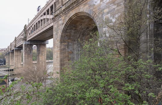 Newcastle, UK - Apr 12, 2025 - A view of The High level bridge (Railway viaduct) is a road and railway bridge spanning the River Tyne connecting Newcastle upon tyne and Gateshead in Newcastle Upon Tyne in the North East of England. use it as your Wallpaper, Poster and Space for text, Selective focus.