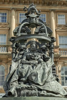 Newcastle, UK - Apr 13, 2025 - Extravagant bronze statue of Queen Victoria in St. Nicholas' Square. The figure of the elderly Queen Victoria is seated on the throne with an elaborate canopy on a Pink granite base is by the sculptor Alfred Gilbert, use it as your Wallpaper, Poster and Copy space, Selective focus.