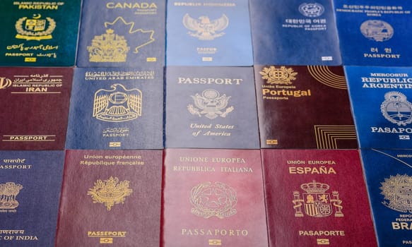 Passports of citizens of different countries of the world, background consisting of passports of several countries.