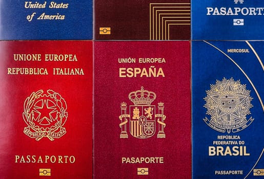 Passports of citizens of different countries of the world, background consisting of passports of several countries.