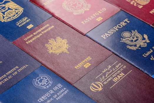 Passports of citizens of different countries of the world, background consisting of passports of several countries.