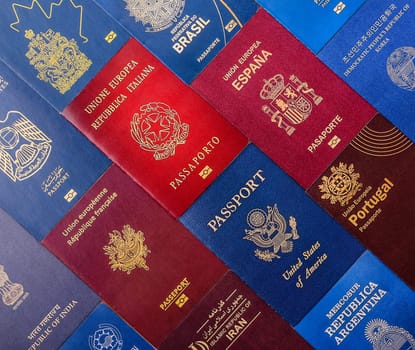 Passports of citizens of different countries of the world, background consisting of passports of several countries.