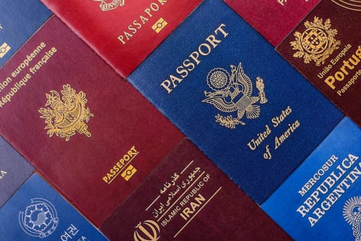 Passports of citizens of different countries of the world, background consisting of passports of several countries.