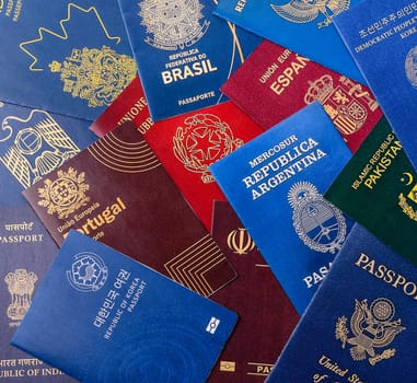 Passports of citizens of different countries of the world, background consisting of passports of several countries.