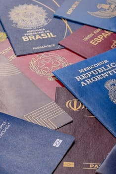 Passports of citizens of different countries of the world, background consisting of passports of several countries.