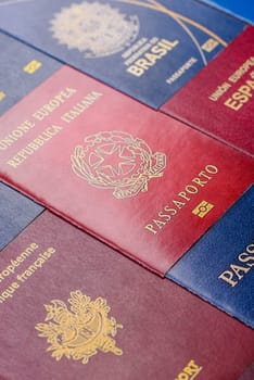 Passports of citizens of different countries of the world, background consisting of passports of several countries.