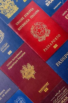 Passports of citizens of different countries of the world, background consisting of passports of several countries.
