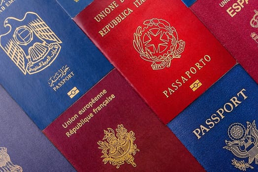Passports of citizens of different countries of the world, background consisting of passports of several countries.