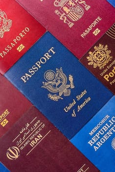 Passports of citizens of different countries of the world, background consisting of passports of several countries.