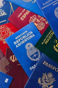 Passports of citizens of different countries of the world, background consisting of passports of several countries.