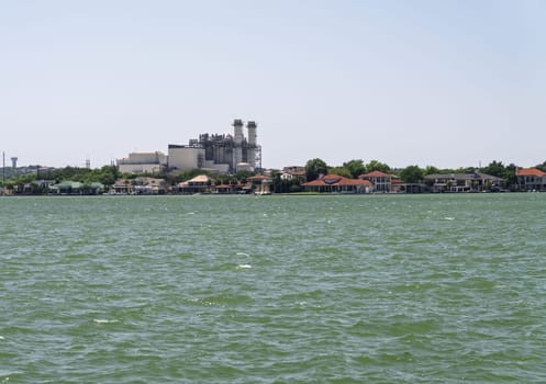 Ferguson natural gas electricity power plant by luxury homes on LBJ Lake near Marble Falls Texas