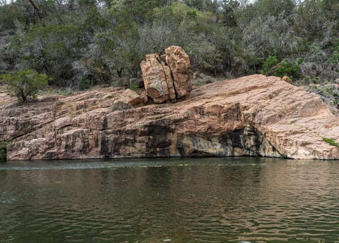 Interesting rock formation at the Devil's Waterhole swimming area in Inks Lake State Park Texas