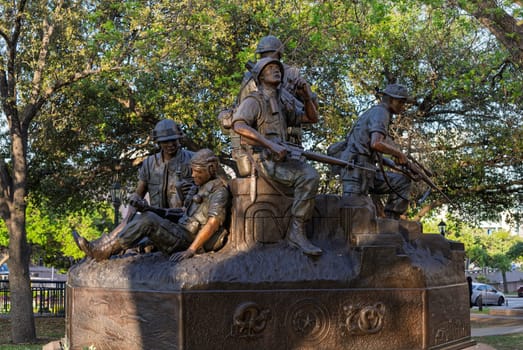 Austin, TX - 10 April 2025: Vietnam Veterans Memorial statue in bronze by State Capitol building in Texas