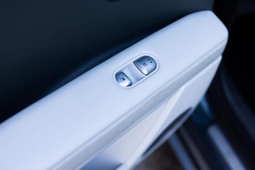 Rear passengers Seat heater button, car interior. Double seat heating switch in a car. Button for heating the rear of seats. Rear seat heated seat controls.