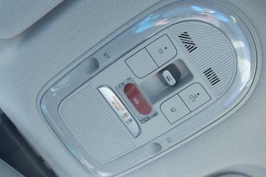 Emergency sos button to contact with call center to ask for help after car accident. SOS button in a car as a symbol for the eCall system in European cars.