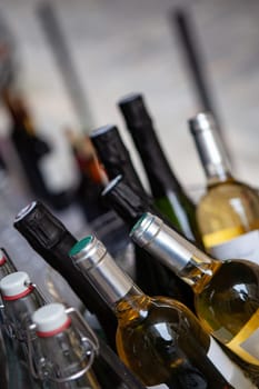 Various bottles in a bucket